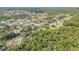 Aerial view of a waterfront neighborhood with canals and mature trees, creating a picturesque and tranquil setting at 154 Godfrey Rd, Edgewater, FL 32141