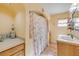 Bright bathroom featuring a walk-in shower, vanity, and charming nautical decor at 154 Godfrey Rd, Edgewater, FL 32141