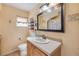 Bright bathroom featuring a single sink vanity, decorative mirror, and maritime-themed decor, creating a charming beachside feel at 154 Godfrey Rd, Edgewater, FL 32141