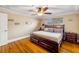 Bright bedroom features a large bed frame with built in storage drawers and a decorative, coffered ceiling at 154 Godfrey Rd, Edgewater, FL 32141