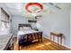 Nicely decorated bedroom features a queen-size bed, and uniquely designed ceiling with a modern ceiling fan at 154 Godfrey Rd, Edgewater, FL 32141