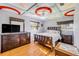 Nicely decorated bedroom features a queen-size bed, and uniquely designed ceiling with a modern ceiling fan at 154 Godfrey Rd, Edgewater, FL 32141