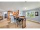 Spacious dining area with a rustic wood table, breakfast bar, and ample natural light at 154 Godfrey Rd, Edgewater, FL 32141