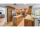 Well-equipped kitchen features stainless steel appliances and ample wood cabinetry for storage at 154 Godfrey Rd, Edgewater, FL 32141