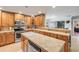 Bright kitchen featuring wood cabinetry, stainless appliances, and convenient countertop space at 154 Godfrey Rd, Edgewater, FL 32141