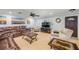 Inviting living room with a large brown leather sofa and a stylish stone-topped coffee table at 154 Godfrey Rd, Edgewater, FL 32141