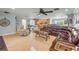 Open-concept living room featuring tile floors, a large sectional, and ample space for relaxation and entertainment at 154 Godfrey Rd, Edgewater, FL 32141