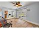 Inviting living room with tile floors, offering seamless access to the outdoor area through glass doors at 154 Godfrey Rd, Edgewater, FL 32141