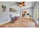 Spacious living room with tile floors, featuring a view of the kitchen and access to the backyard at 154 Godfrey Rd, Edgewater, FL 32141