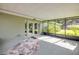 Enclosed patio featuring a neutral rug, screen windows, and glass french doors leading inside at 154 Godfrey Rd, Edgewater, FL 32141
