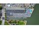 Aerial view looking straight down at condo building, parking and marina at 101 N Riverside Dr # 1090, New Smyrna Beach, FL 32168