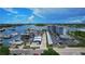 An aerial view of the condo building, parking, and marina in this waterfront community at 101 N Riverside Dr # 1090, New Smyrna Beach, FL 32168