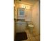 Cozy half bathroom featuring tiled flooring, single sink vanity, and medicine cabinet at 101 N Riverside Dr # 1090, New Smyrna Beach, FL 32168
