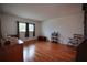Bedroom with wood floors, rocking chair, two windows, and ample space at 101 N Riverside Dr # 1090, New Smyrna Beach, FL 32168