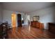 Spacious bedroom with wood floors and multiple access doors with natural light at 101 N Riverside Dr # 1090, New Smyrna Beach, FL 32168