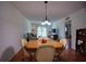 Dining room with hardwood floors and views into the living room at 101 N Riverside Dr # 1090, New Smyrna Beach, FL 32168