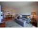 Inviting living room with comfortable seating, a patterned rug, and access to the dining area at 101 N Riverside Dr # 1090, New Smyrna Beach, FL 32168
