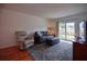 Bright living room features a comfortable seating area and sliding glass doors to the outside at 101 N Riverside Dr # 1090, New Smyrna Beach, FL 32168