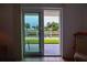 Waterfront view from sliding glass doors showing beautiful trees and a clear canal at 101 N Riverside Dr # 1090, New Smyrna Beach, FL 32168