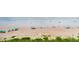 This aerial shot shows a beach with blue umbrellas, and the ocean at 1051 Ocean Shore Blvd # 502, Ormond Beach, FL 32176