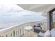 Inviting balcony showcasing ocean views, comfortable seating, and decorative railings at 1051 Ocean Shore Blvd # 502, Ormond Beach, FL 32176