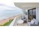 Balcony with seating overlooks the beach and ocean at 1051 Ocean Shore Blvd # 502, Ormond Beach, FL 32176