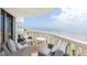 An outdoor balcony features comfortable seating and offers stunning views of the beach and ocean at 1051 Ocean Shore Blvd # 502, Ormond Beach, FL 32176