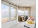 Relaxing sunroom offers stunning ocean views and comfortable seating, leading to an outdoor balcony at 1051 Ocean Shore Blvd # 502, Ormond Beach, FL 32176