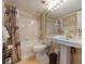 Bathroom featuring a tub with shower, tile walls, and decorative curtain at 1051 Ocean Shore Blvd # 502, Ormond Beach, FL 32176