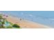 Picturesque beach scene with families enjoying the sun and surf, showcasing the coastal lifestyle at 1051 Ocean Shore Blvd # 502, Ormond Beach, FL 32176