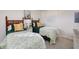 Bedroom with twin beds, wooden headboards, and a dresser at 1051 Ocean Shore Blvd # 502, Ormond Beach, FL 32176