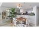 Bright dining area features a round table, seating for four, and a large mirror reflecting the space at 1051 Ocean Shore Blvd # 502, Ormond Beach, FL 32176