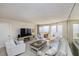 The living room includes an ocean view, a large TV and comfortable seating at 1051 Ocean Shore Blvd # 502, Ormond Beach, FL 32176