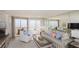 Comfortable living room with a beach view, a large sofa and lots of light at 1051 Ocean Shore Blvd # 502, Ormond Beach, FL 32176