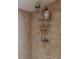 Close-up of shower featuring tile surround and modern shower head at 1051 Ocean Shore Blvd # 502, Ormond Beach, FL 32176