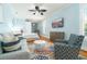 Stylish studio apartment with a seating area, bed, and TV at 1212 S Riverside Dr, New Smyrna Beach, FL 32168