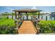 A covered boat dock offers waterfront access and includes a boat lift and seating at 1212 S Riverside Dr, New Smyrna Beach, FL 32168