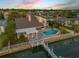 Stunning waterfront home featuring a private pool, covered patio, and a long dock at 1219 Commodore Dr, New Smyrna Beach, FL 32168