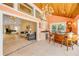 Unique boat-themed bar area open to the living room with high ceilings and adjacent water views at 1219 Commodore Dr, New Smyrna Beach, FL 32168