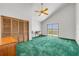 Spacious bedroom featuring green carpet, vaulted ceilings, and a sliding glass door with an ocean view at 1219 Commodore Dr, New Smyrna Beach, FL 32168