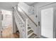 Inviting entryway with stairs, a light-filled doorway, and stylish decor leading into the home at 1219 Commodore Dr, New Smyrna Beach, FL 32168