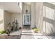 Charming front entrance featuring an elegant door, a lantern, and decorative pelican statues at 1219 Commodore Dr, New Smyrna Beach, FL 32168