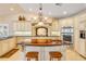 Elegant kitchen features custom cabinetry, granite countertops, a wood island, and modern appliances at 1219 Commodore Dr, New Smyrna Beach, FL 32168