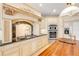 Gourmet kitchen with custom cabinetry, gas range, and stainless steel appliances at 1219 Commodore Dr, New Smyrna Beach, FL 32168