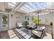 A stylish patio area with comfortable seating and a neutral outdoor rug at 1219 Commodore Dr, New Smyrna Beach, FL 32168