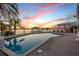The pool area has lounge chairs and a pergola covered patio overlooking the water at 1219 Commodore Dr, New Smyrna Beach, FL 32168