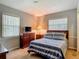 Bedroom featuring natural light, dresser, and cozy bed, providing a peaceful and relaxing space for rest at 1331 Needle Palm Dr, Edgewater, FL 32132