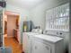 Practical laundry area equipped with a washer, dryer, and ample natural light at 1331 Needle Palm Dr, Edgewater, FL 32132