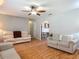 Open-concept living room with hardwood floors, plenty of natural light and neutral paint at 1331 Needle Palm Dr, Edgewater, FL 32132