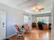 Inviting office space with wood floors, a ceiling fan, and comfortable seating for a productive work environment at 1331 Needle Palm Dr, Edgewater, FL 32132